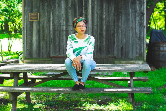 Woman sitting on picnic table